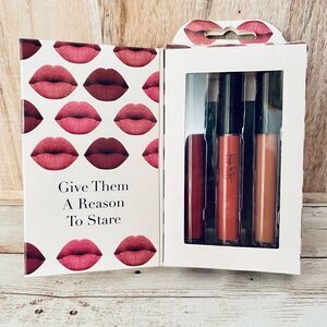 New in Box Nicole Miller Lip Gloss Trio with 3 different beautiful colors